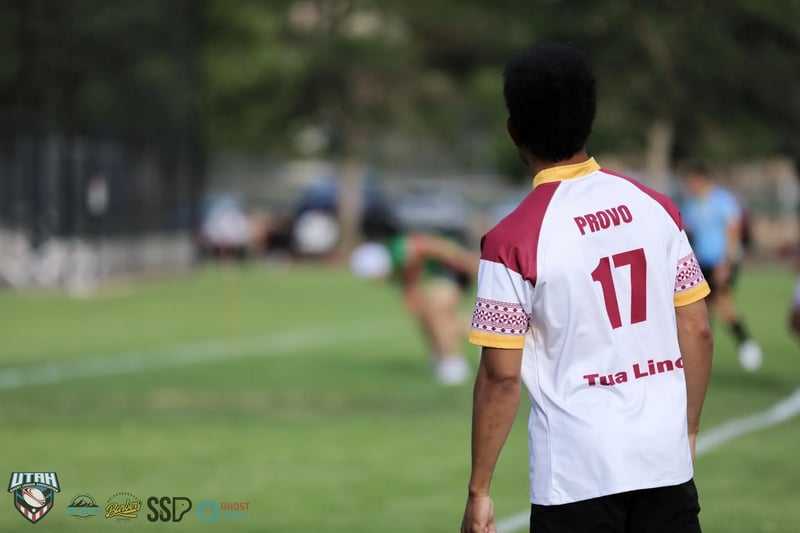 Back view of a Broncos player's white number 17 jersey with red Provo lettering, shallow focus