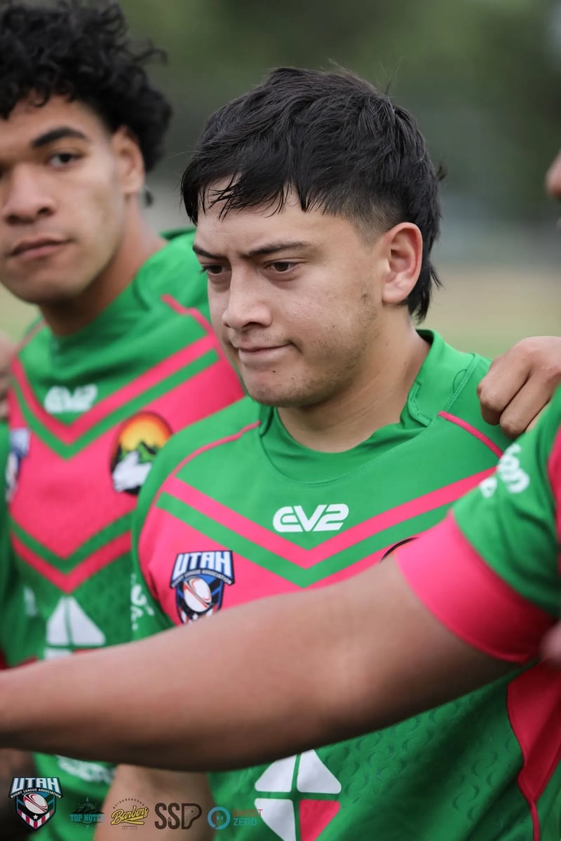 Rabbitahz player bows his head between teammates in the huddle