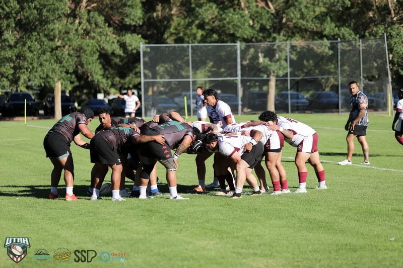 Both packs bound in a scrum, Rabbitahz in black with green and red hoops against Seagulls in white and maroon, halves waiting behind.