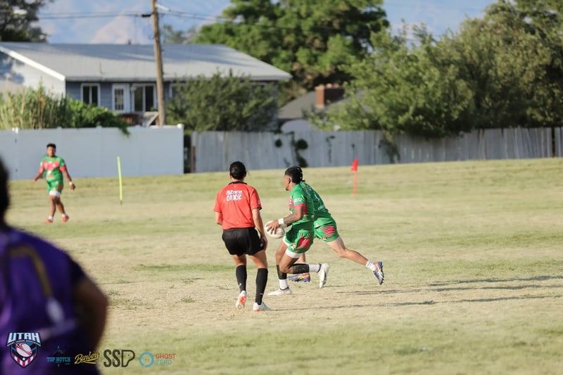 A wide view of the festival-day pitch at South Ridge Park with players in open space.