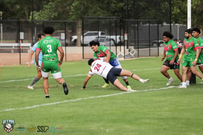 Broncos ball carrier is dragged down mid-dive by a Rabbitahz defender as support players close in