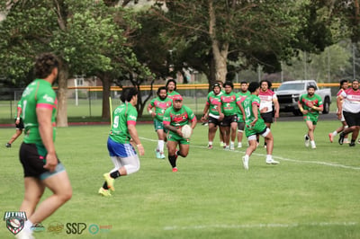 Rabbitahz ball carrier runs through midfield with teammates in support behind