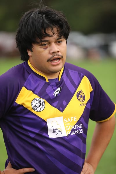 Close-up of a Raiders player in the purple and gold jersey after a match