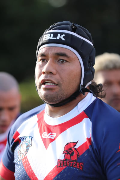 Close-up of a Roosters player wearing black protective headgear