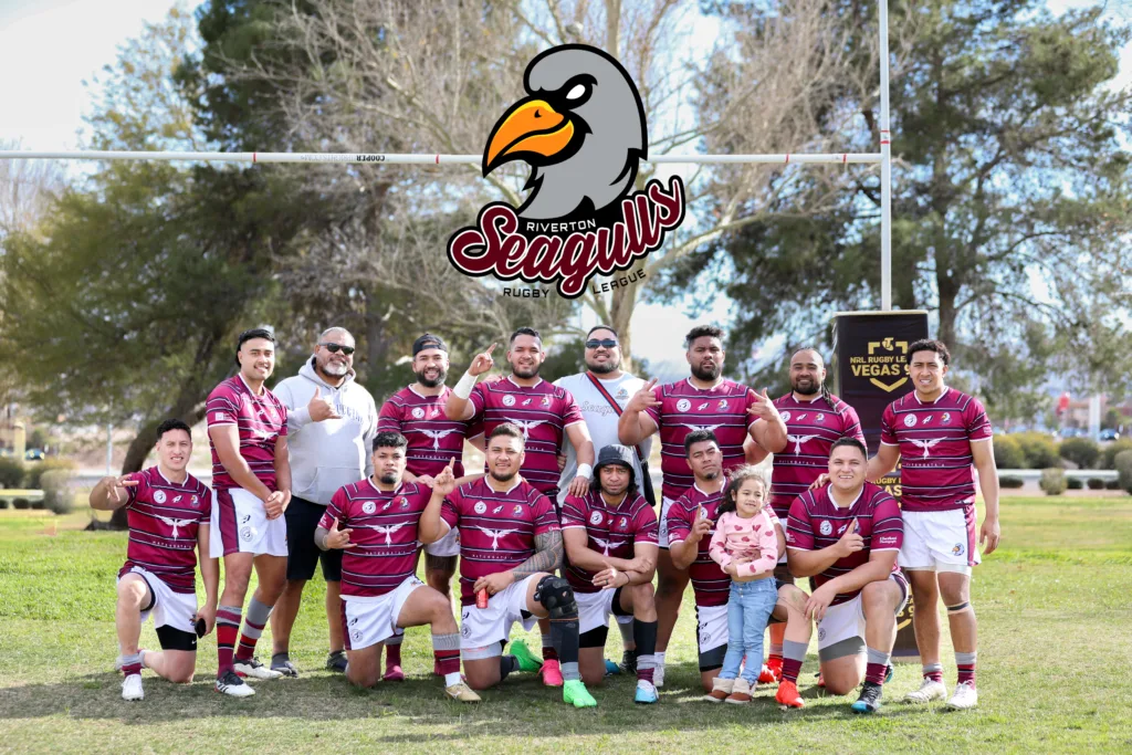 Riverton Seagulls players in maroon and white posing for a team photo on the field